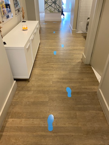 Footprints indicating the one-direction system on the office floor.