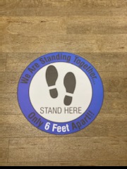 Floor indicator for standing six feet apart.